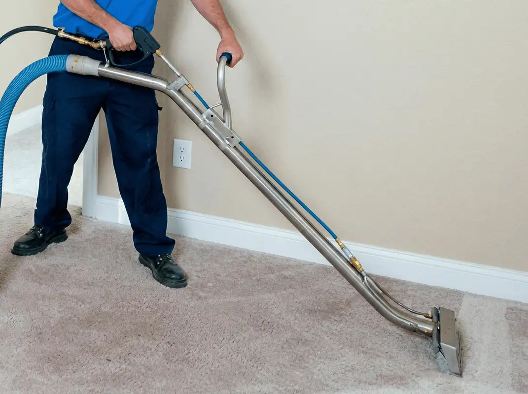 Professional operating a liquid removal machine on a carpeted floor in Tacoma, WA